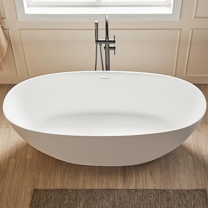 Cpingao 63" Solid Surface Freestanding Bathtub, Modern Oval Shape Soaking Tub, Stone Resin Stand Alone Bathtub with Drain & Integrated Slotted Overflow Matte White 8845-1600
